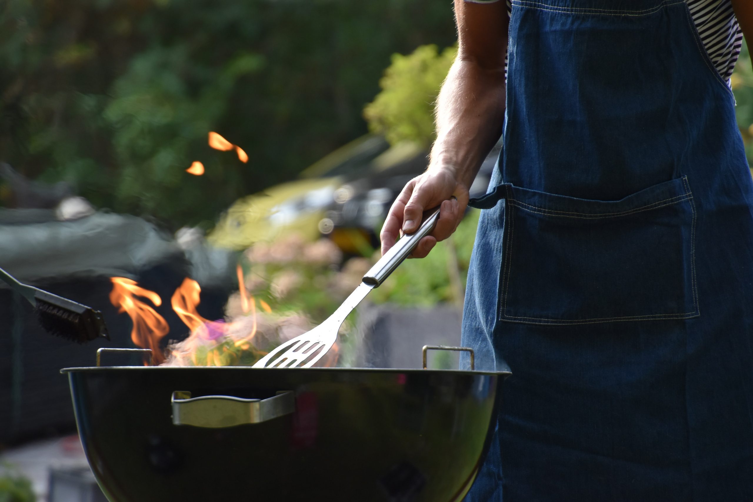 roche awnings man grilling outdoor bbq